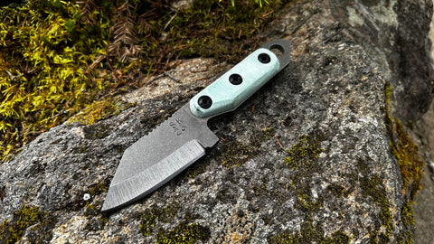 2023 Shed Knives US Tanto on mossy rock – a perfect blend of style and functionality