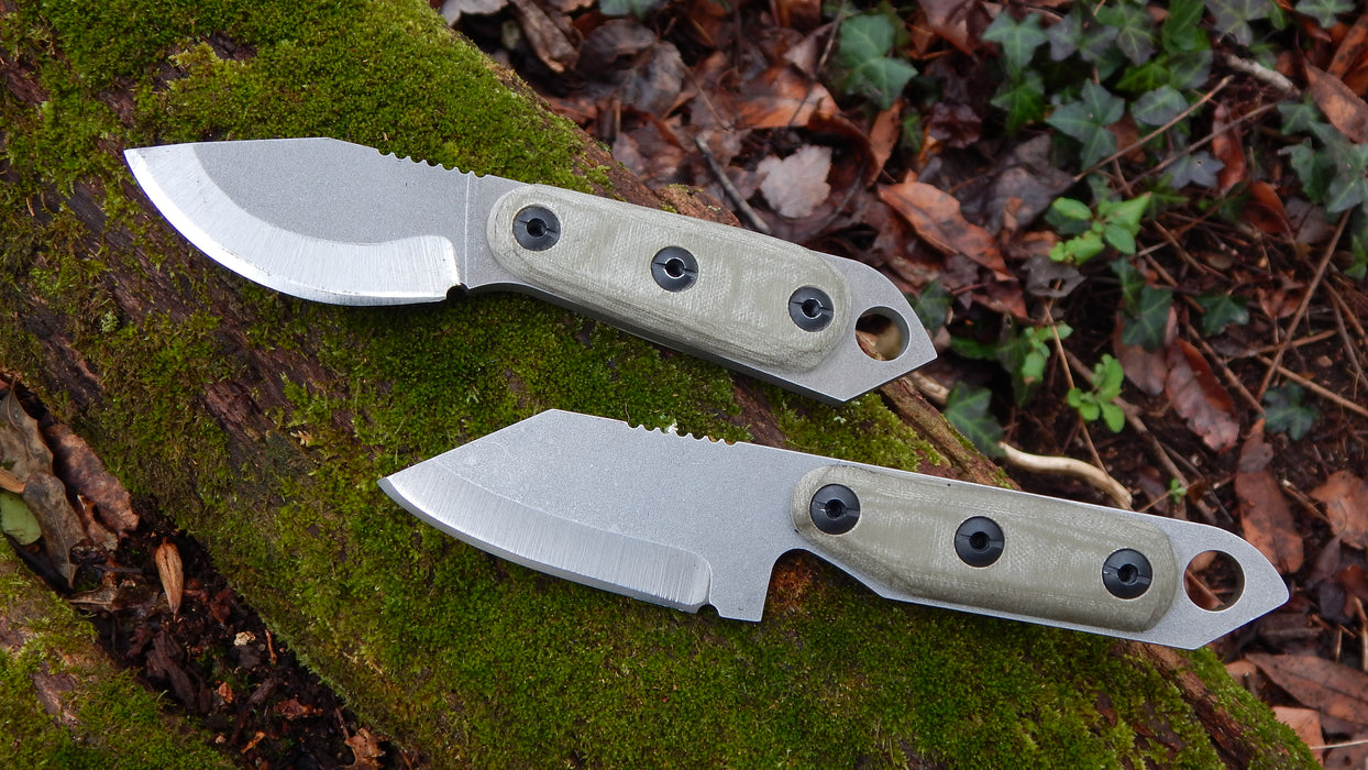 2023 Shed Knives Skur & US Tanto in OD Green G-10 on a mossy log.